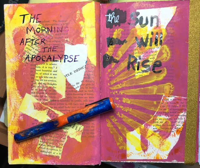 A photo of an altered journal, made by Lisa. Partial pages of other books have been ripped out and meshed together. An overlay of paint and marker drawings covers them. Lisa wrote in black, "THE MORNING AFTER THE APOCALYPSE the Sun Will Rise."
