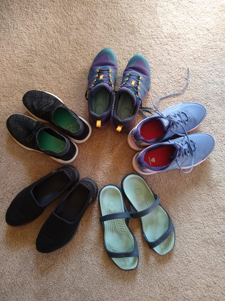 A photo of my five essential pairs of shoes, arranged in a circle.